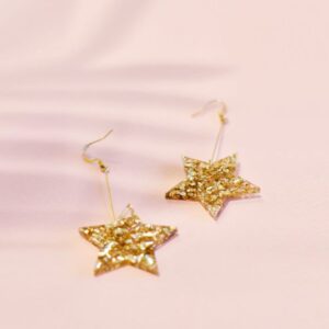 Star shaped gold drop earrings